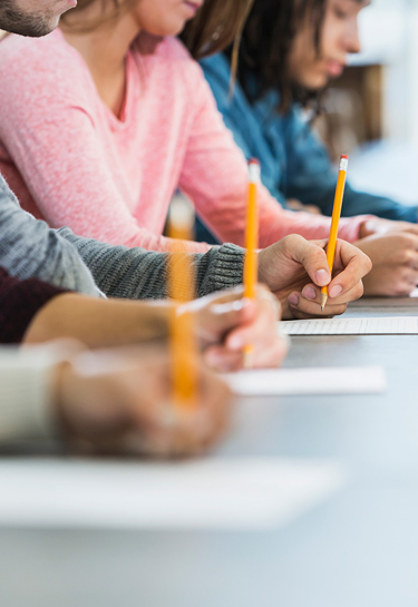 students taking written driving test with certified driving school